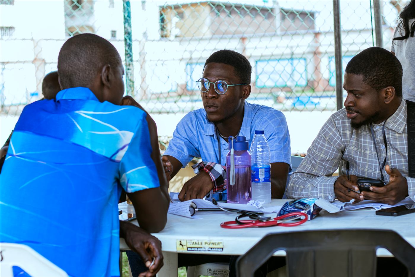 Dr Tolulope Ajidahun consulting with a patient at a free community health outreach clinic in Lagos, Nigeria
